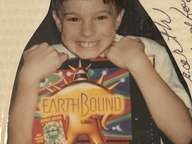 Me holding my EarthBound box at age 9